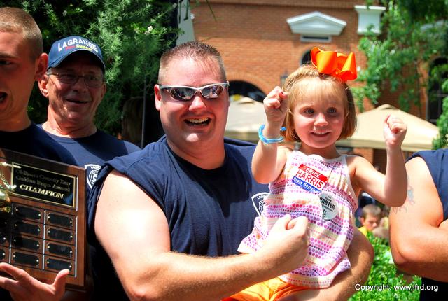 Dad gets help with the muscle flex!!